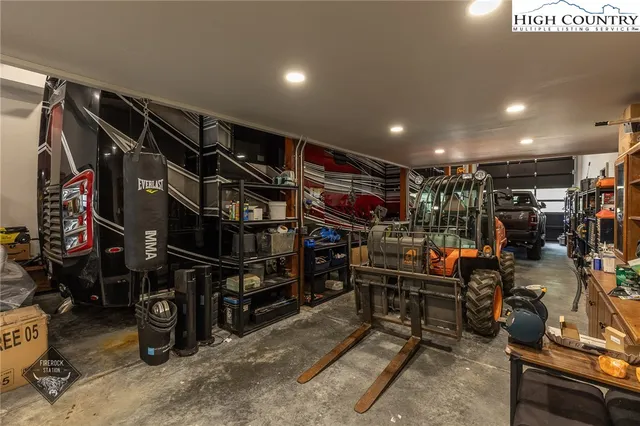 a view of a chairs and table in the back yard