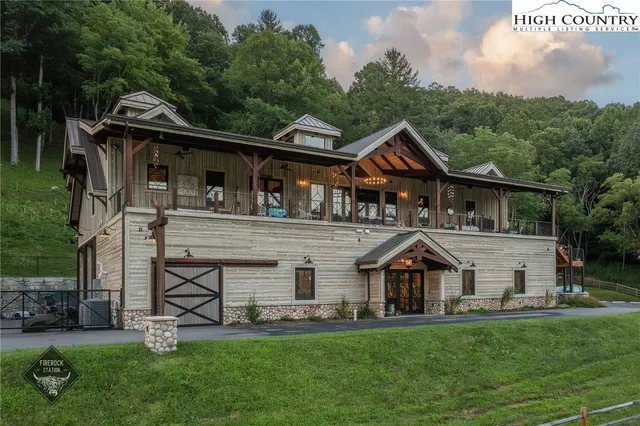 a view of a house with roof deck front of house