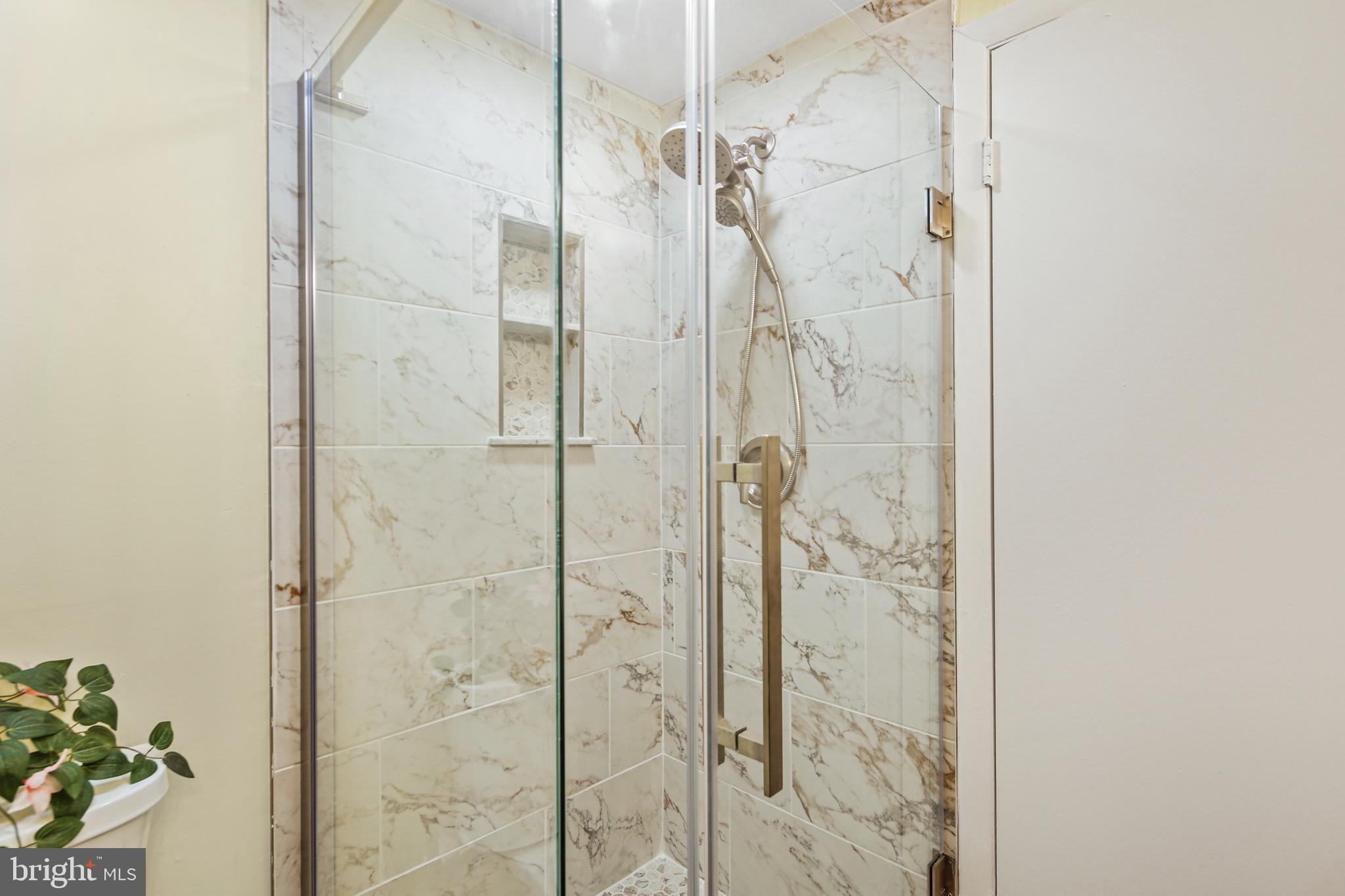 2 Bailiffs Court, Unit 102 Lutherville-Timonium, MD 21093 - Photo 11 of 34 a bathroom with a shower