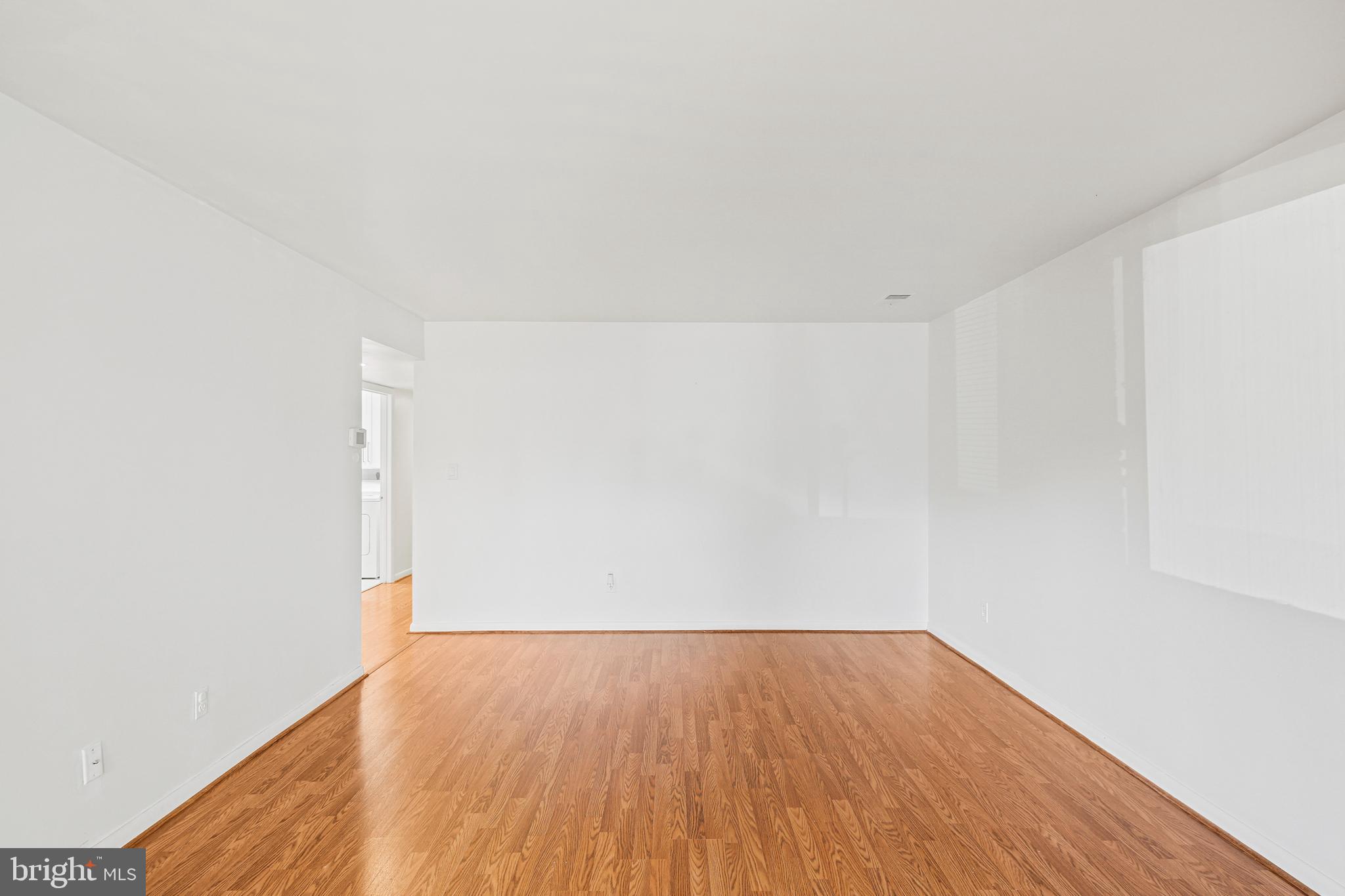 2 Bailiffs Court, Unit 102 Lutherville-Timonium, MD 21093 - Photo 12 of 34 a view of an empty room with wooden floor
