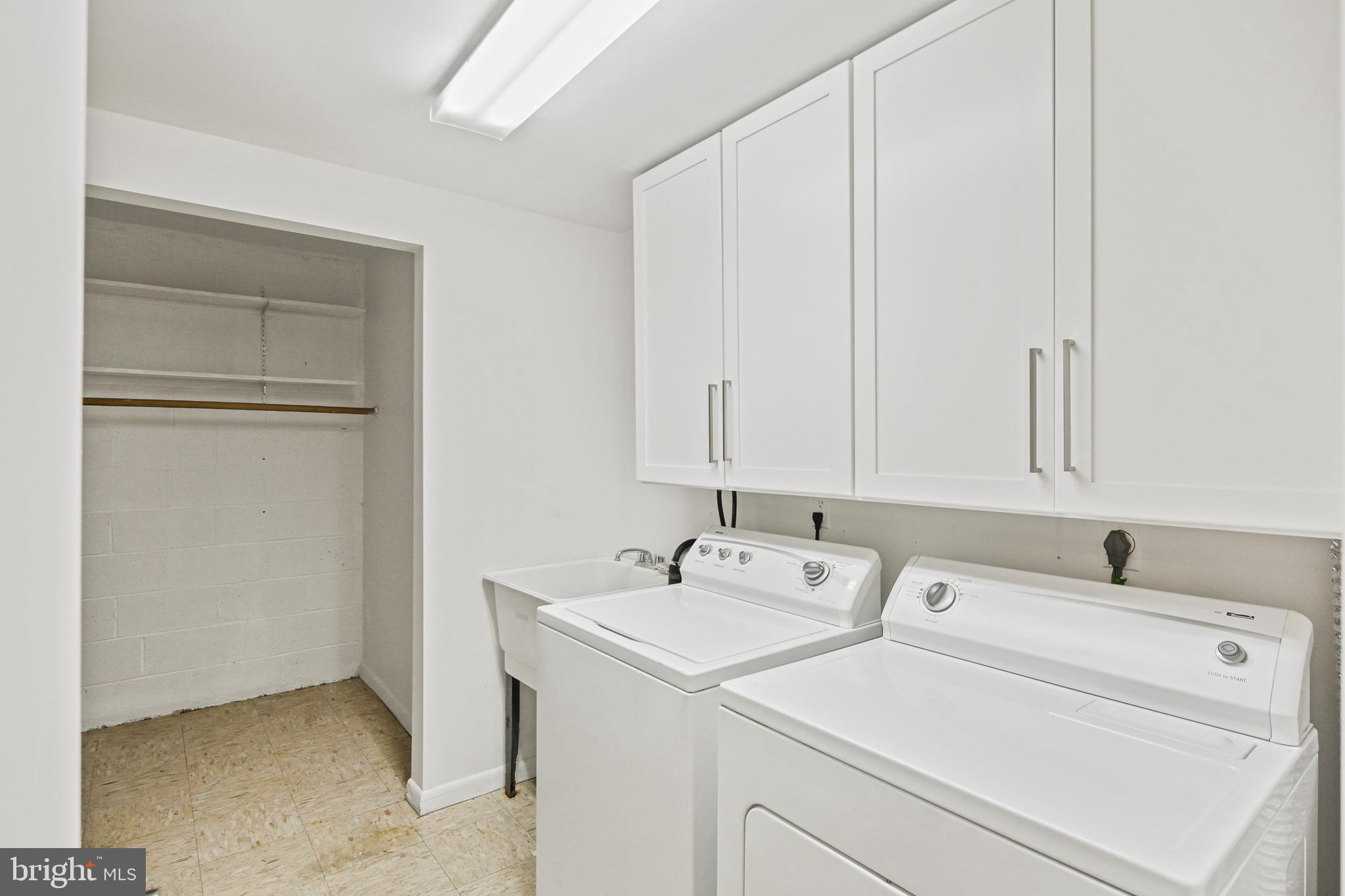 2 Bailiffs Court, Unit 102 Lutherville-Timonium, MD 21093 - Photo 19 of 34 a utility room with dryer and washer