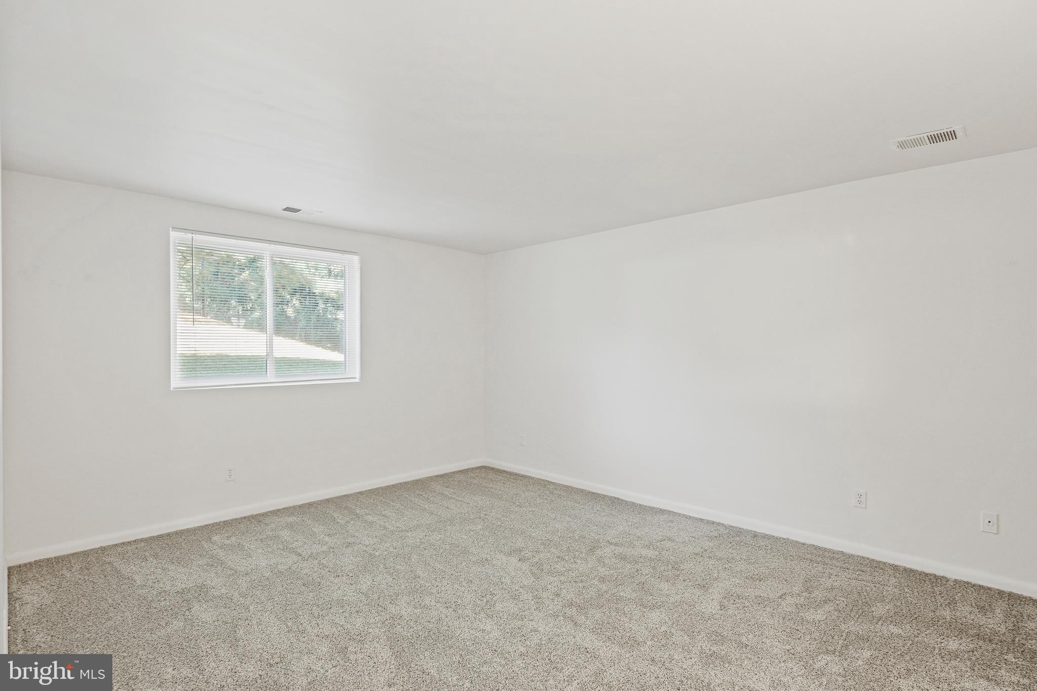 2 Bailiffs Court, Unit 102 Lutherville-Timonium, MD 21093 - Photo 24 of 34 an empty room with a window