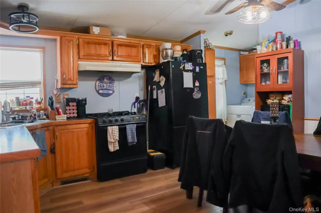a view of living room and wooden furniture