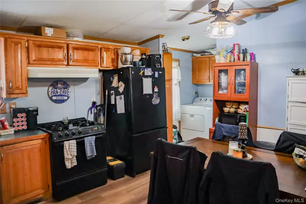 a view of a livingroom with furniture and workspace