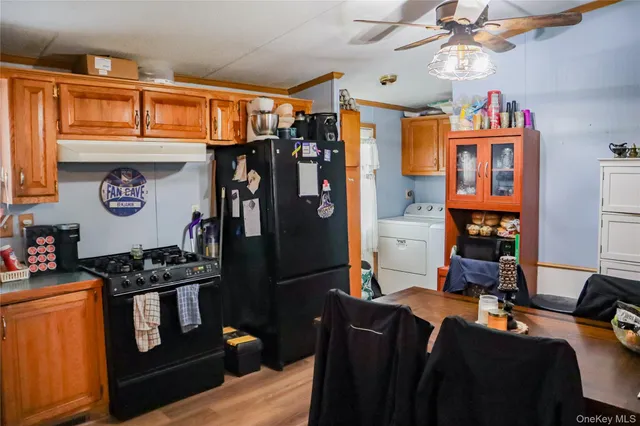 a view of a livingroom with furniture and workspace
