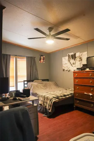 a bed room with a bed and a television