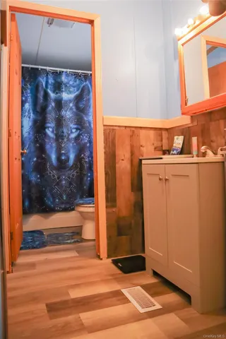 a view of a door and wooden floor