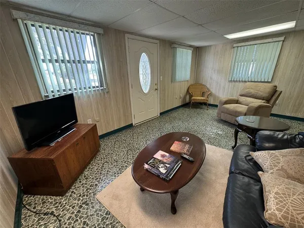 a bedroom with a bed and a ceiling fan