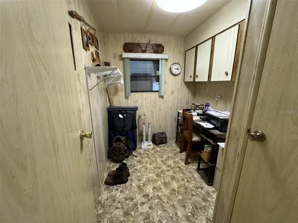 a bathroom with a granite countertop sink mirror vanity and toilet