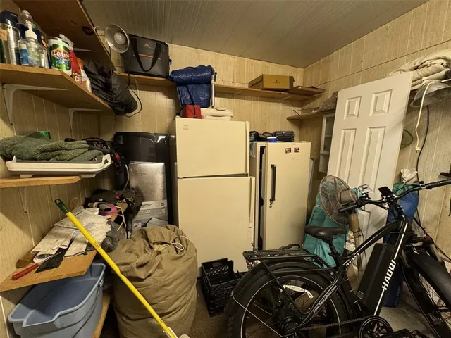 a view of a big yard with table and chairs