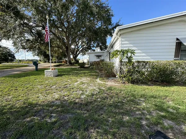 a view of house with outdoor space and street view