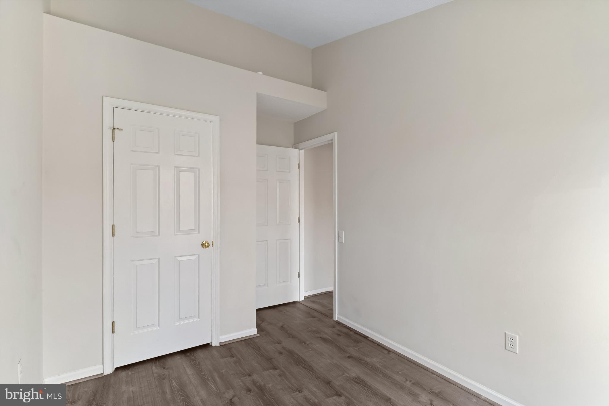 7115 Strawn Court Alexandria, VA 22306 - Photo 16 of 27 a view of an empty room with wooden floor