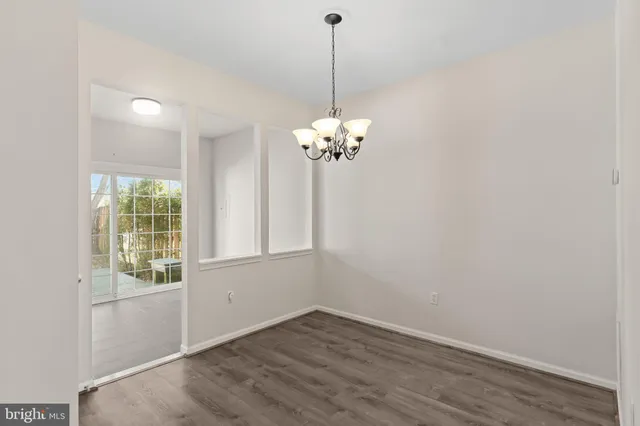 a view of a chandelier in big room and chandelier