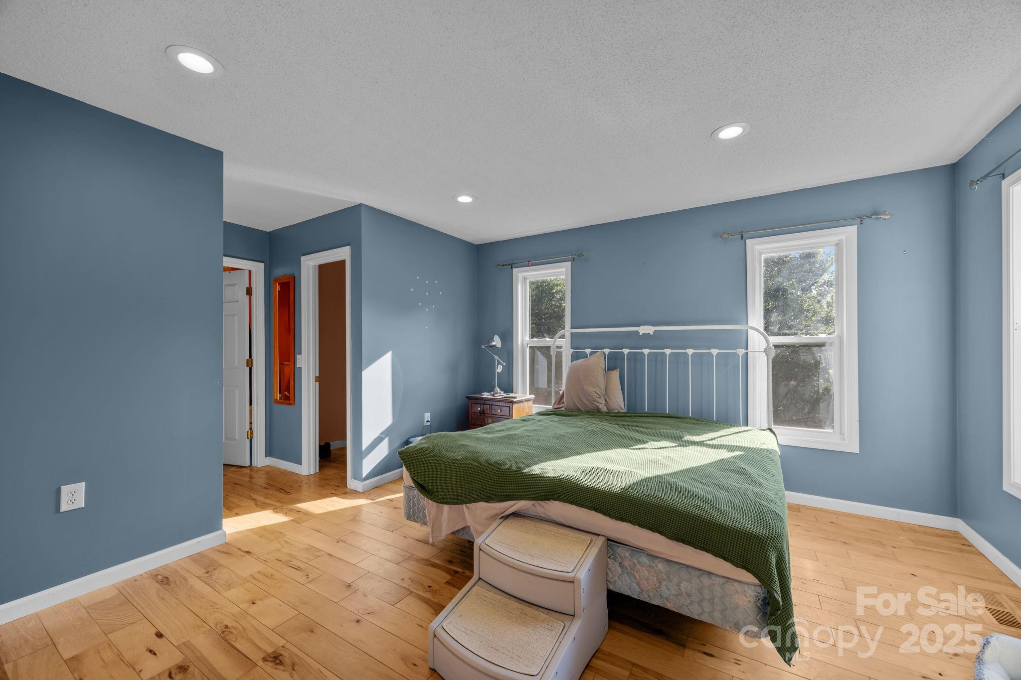 55 Pine Bluff Road Hendersonville, NC 28792 - Photo 14 of 47 a bedroom with a large bed and a window