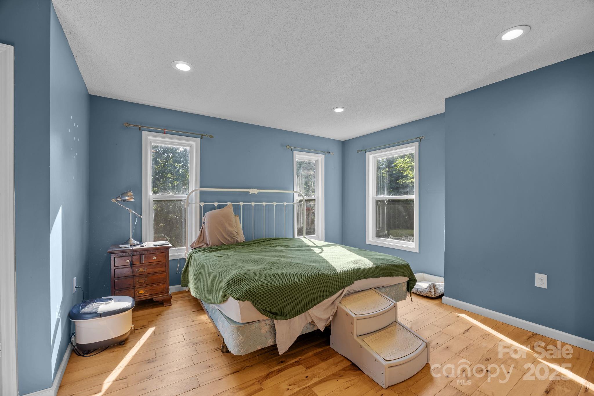 55 Pine Bluff Road Hendersonville, NC 28792 - Photo 15 of 47 a bedroom with a bed and window