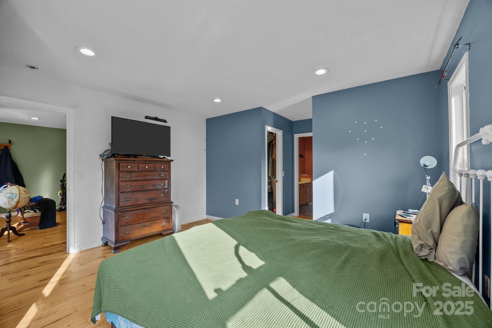 55 Pine Bluff Road Hendersonville, NC 28792 - Photo 16 of 47 a bedroom with a bed and a television