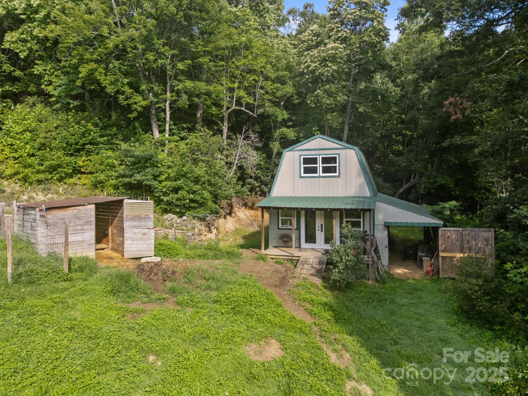 55 Pine Bluff Road Hendersonville, NC 28792 - Photo 28 of 47 a front view of a house with garden