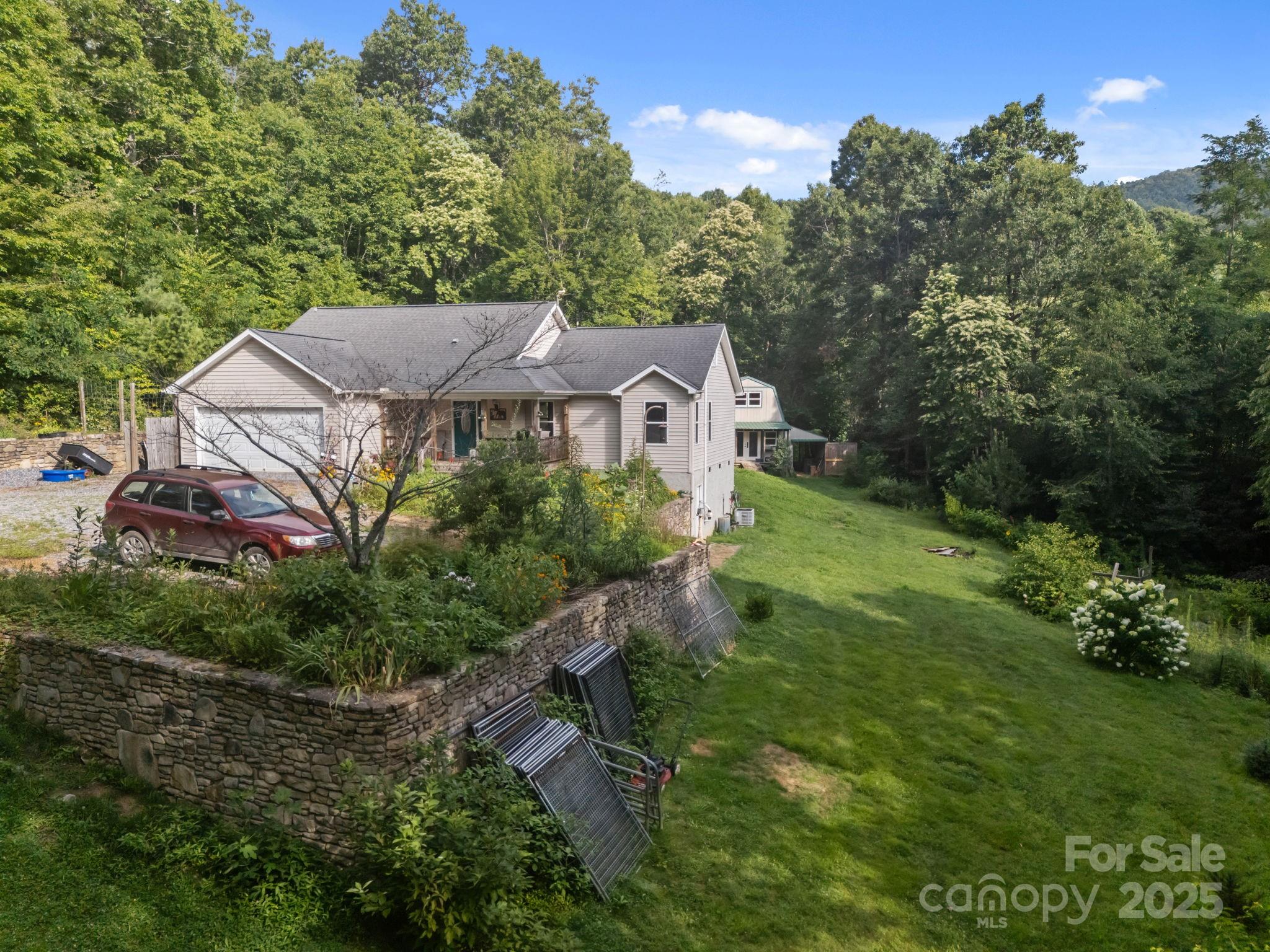 55 Pine Bluff Road Hendersonville, NC 28792 - Photo 30 of 47 an aerial view of a house with yard and green space