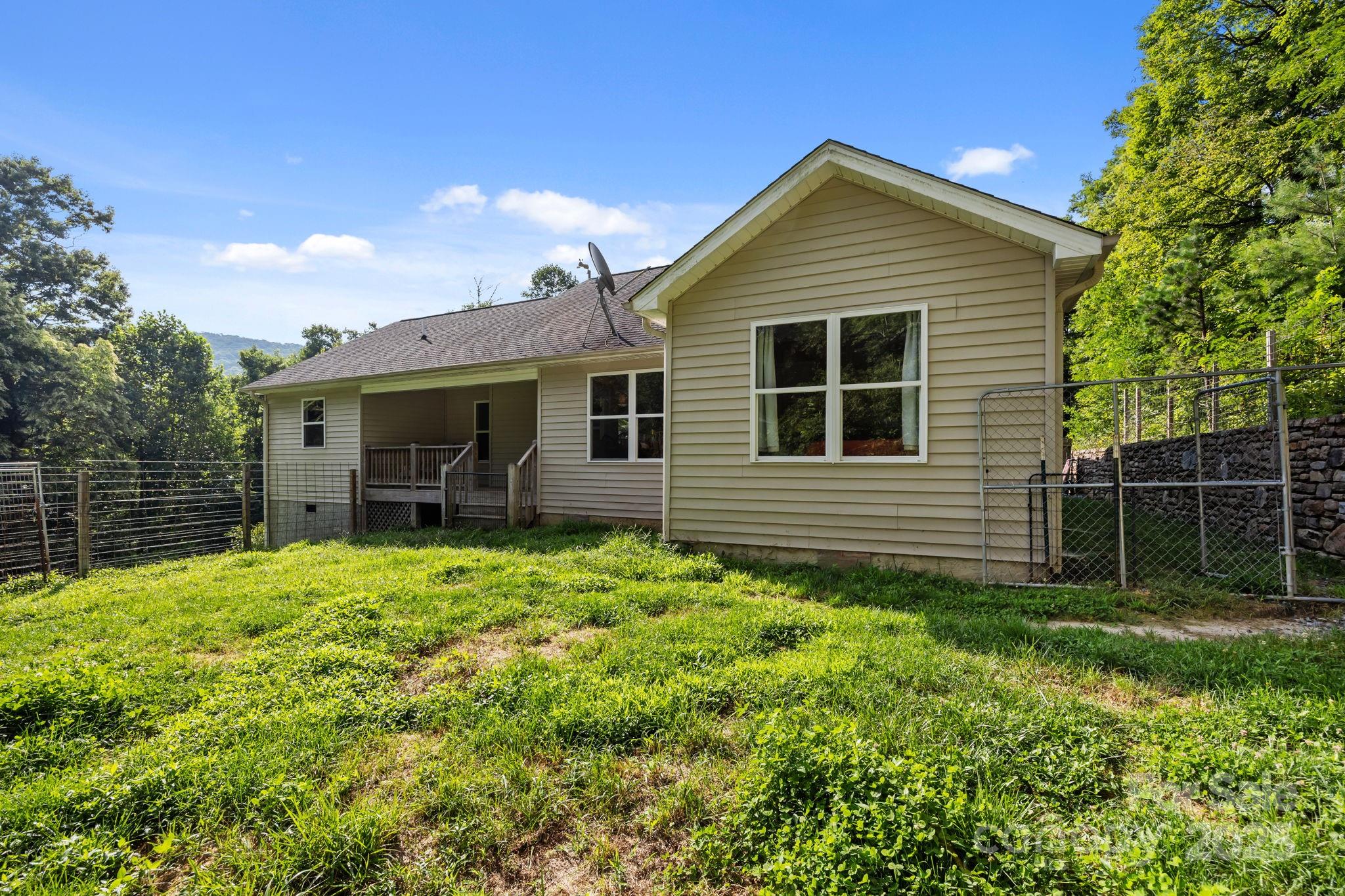 55 Pine Bluff Road Hendersonville, NC 28792 - Photo 35 of 47 a front view of a house with a yard
