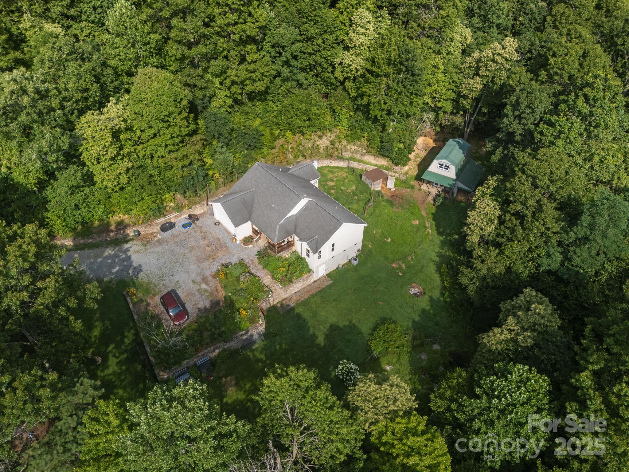 55 Pine Bluff Road Hendersonville, NC 28792 - Photo 38 of 47 an aerial view of a house with a yard