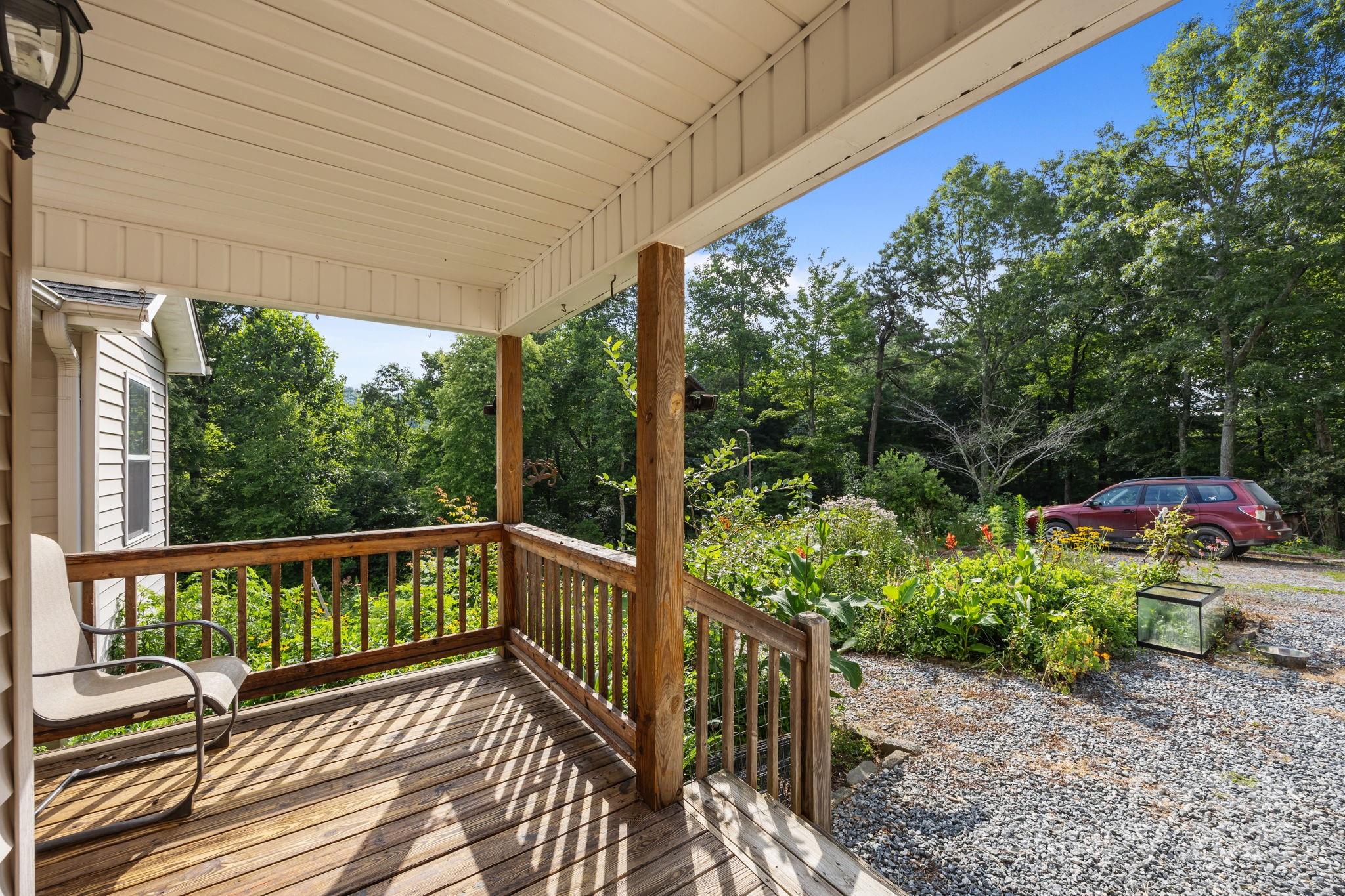 55 Pine Bluff Road Hendersonville, NC 28792 - Photo 45 of 47 a view of a wooden deck with furniture