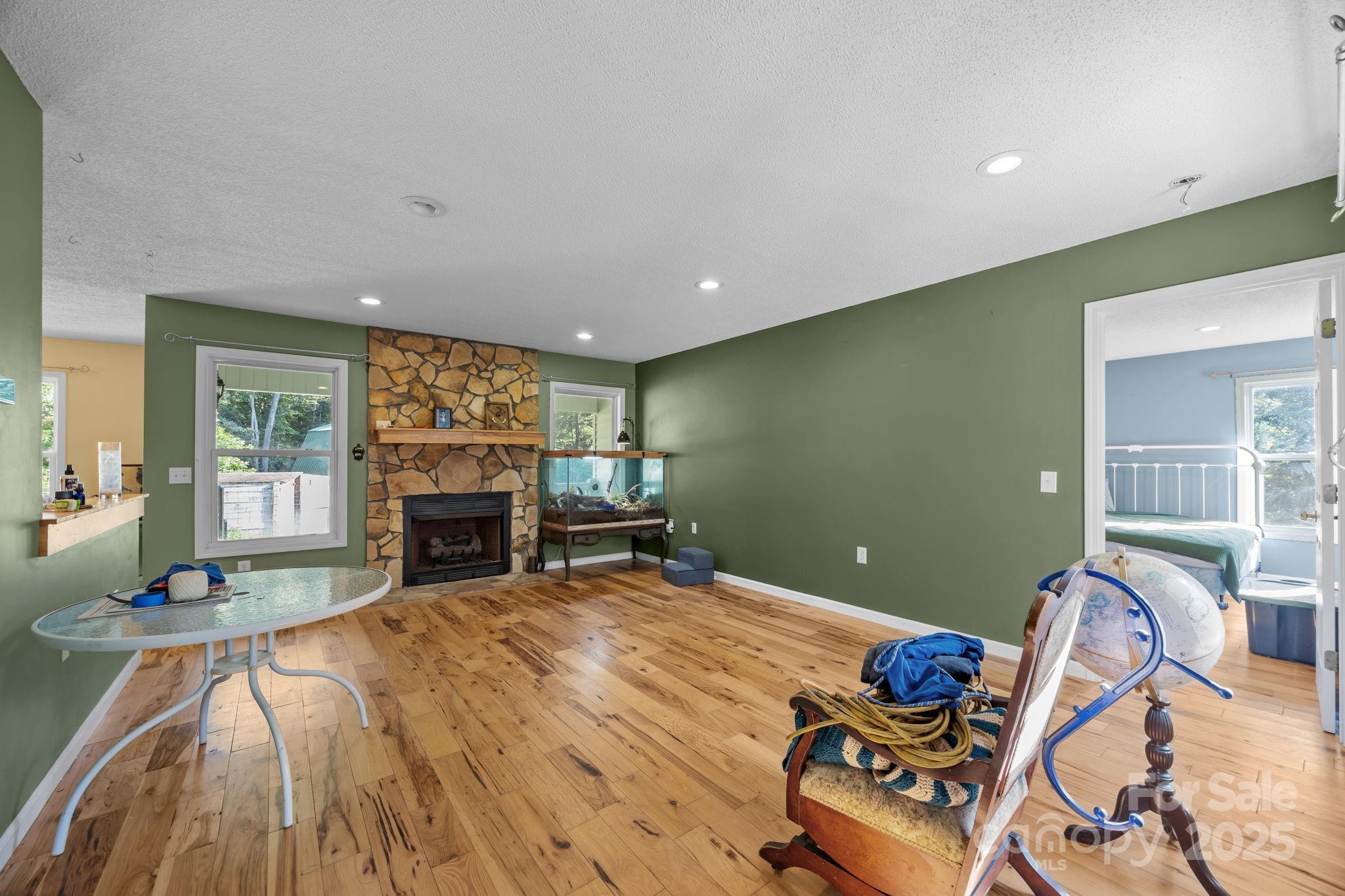 55 Pine Bluff Road Hendersonville, NC 28792 - Photo 5 of 47 a view of a livingroom with furniture and a fireplace