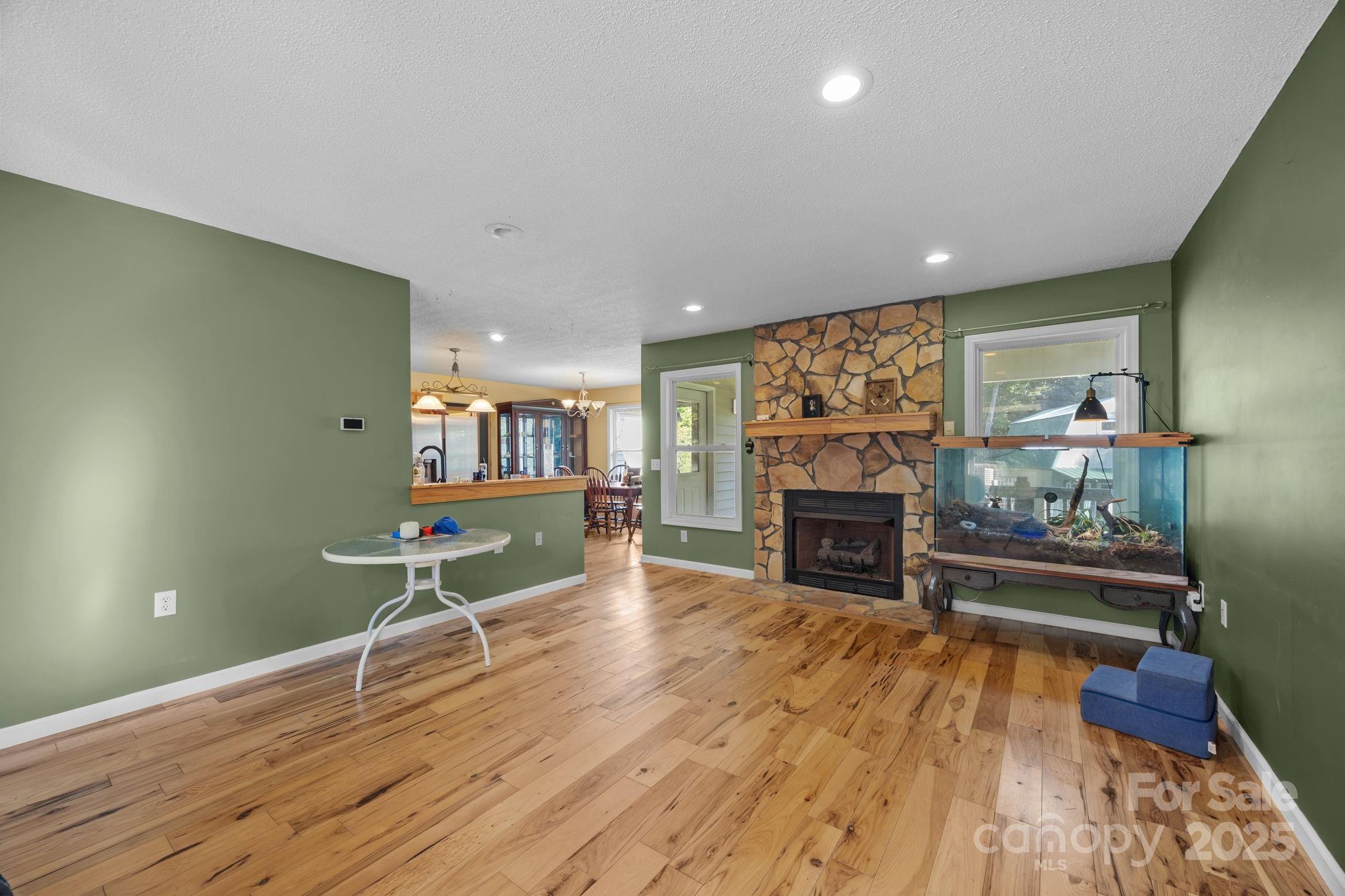 55 Pine Bluff Road Hendersonville, NC 28792 - Photo 6 of 47 a living room with furniture and a fireplace