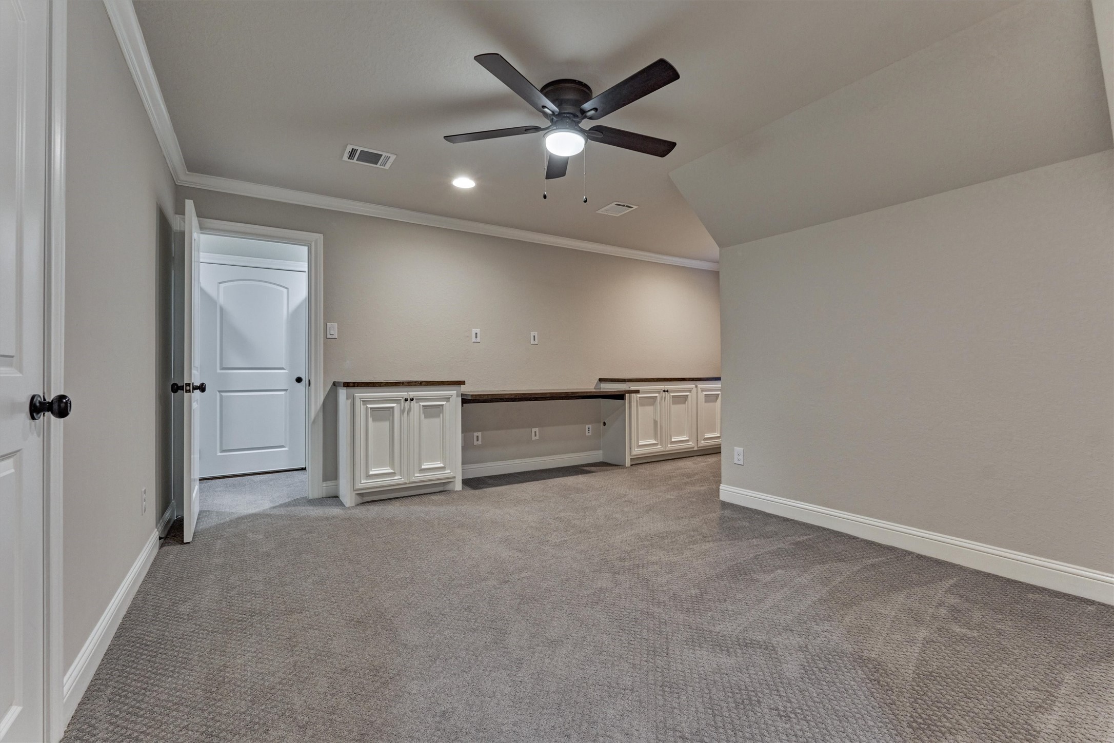 11618 Renaissance Drive Montgomery, TX 77356 - Photo 32 of 49 The upstairs bedroom features a built-in desk and cabinetry, a spacious walk-in closet, and an adjacent full bath- perfect for guests or a teenager's retreat.