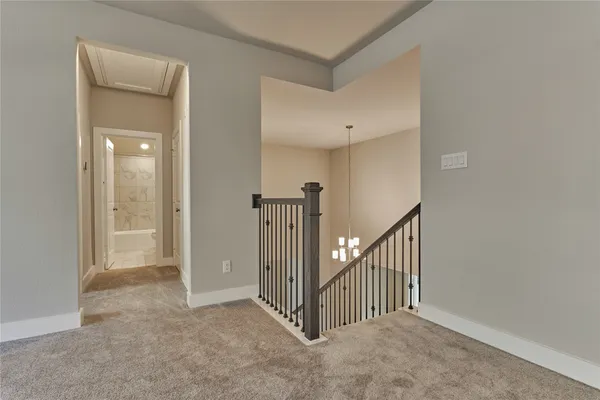a view of a hallway with staircase