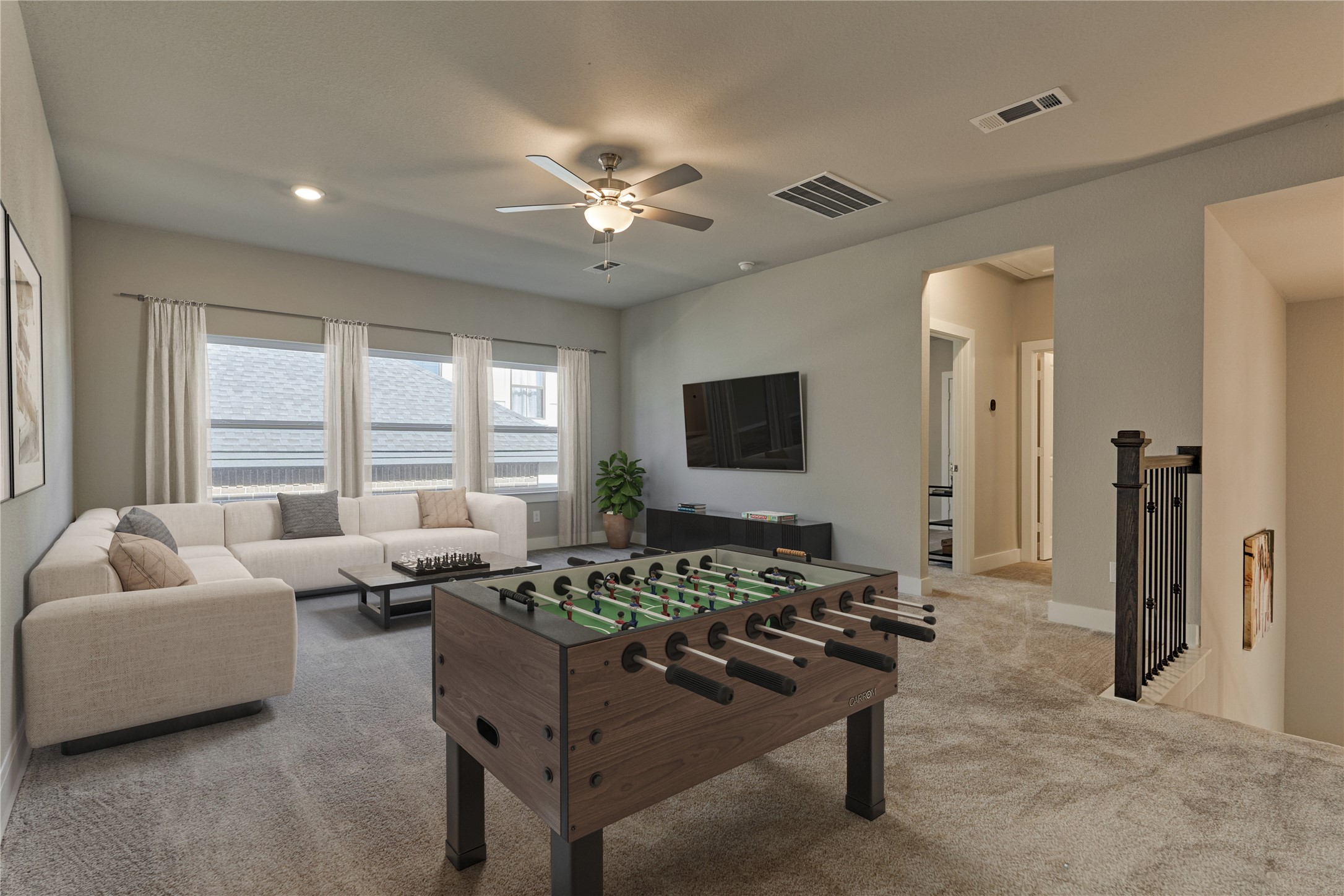 1716 Encino Boulevard Conroe, TX 77304 - Photo 39 of 50 Upstairs, the versatile game room offers a relaxed space for play or movie nights, providing the perfect retreat for all ages.