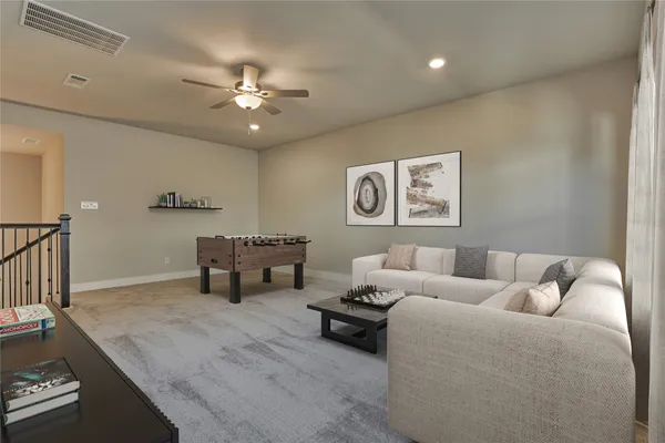 a living room with furniture and a chandelier