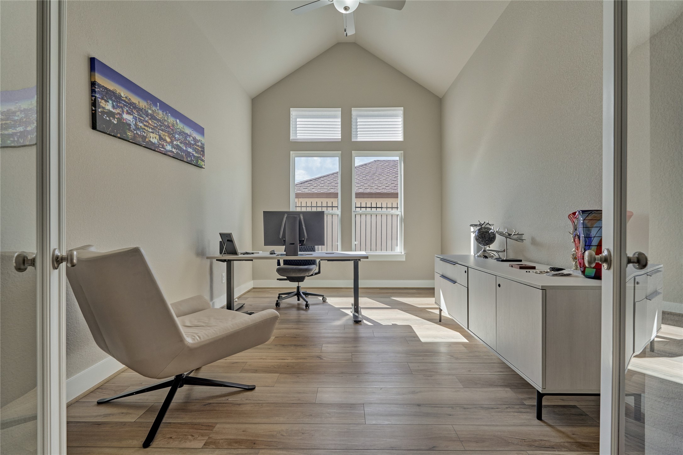 1716 Encino Boulevard Conroe, TX 77304 - Photo 9 of 50 This amazing work space features a vaulted ceiling and bright sunny windows.
