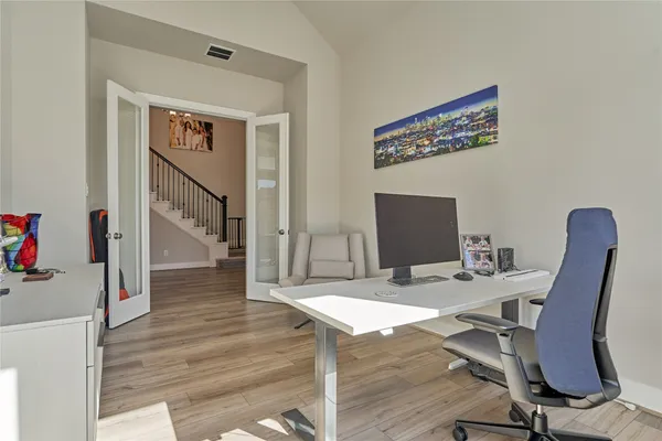 a workspace with furniture and wooden floor