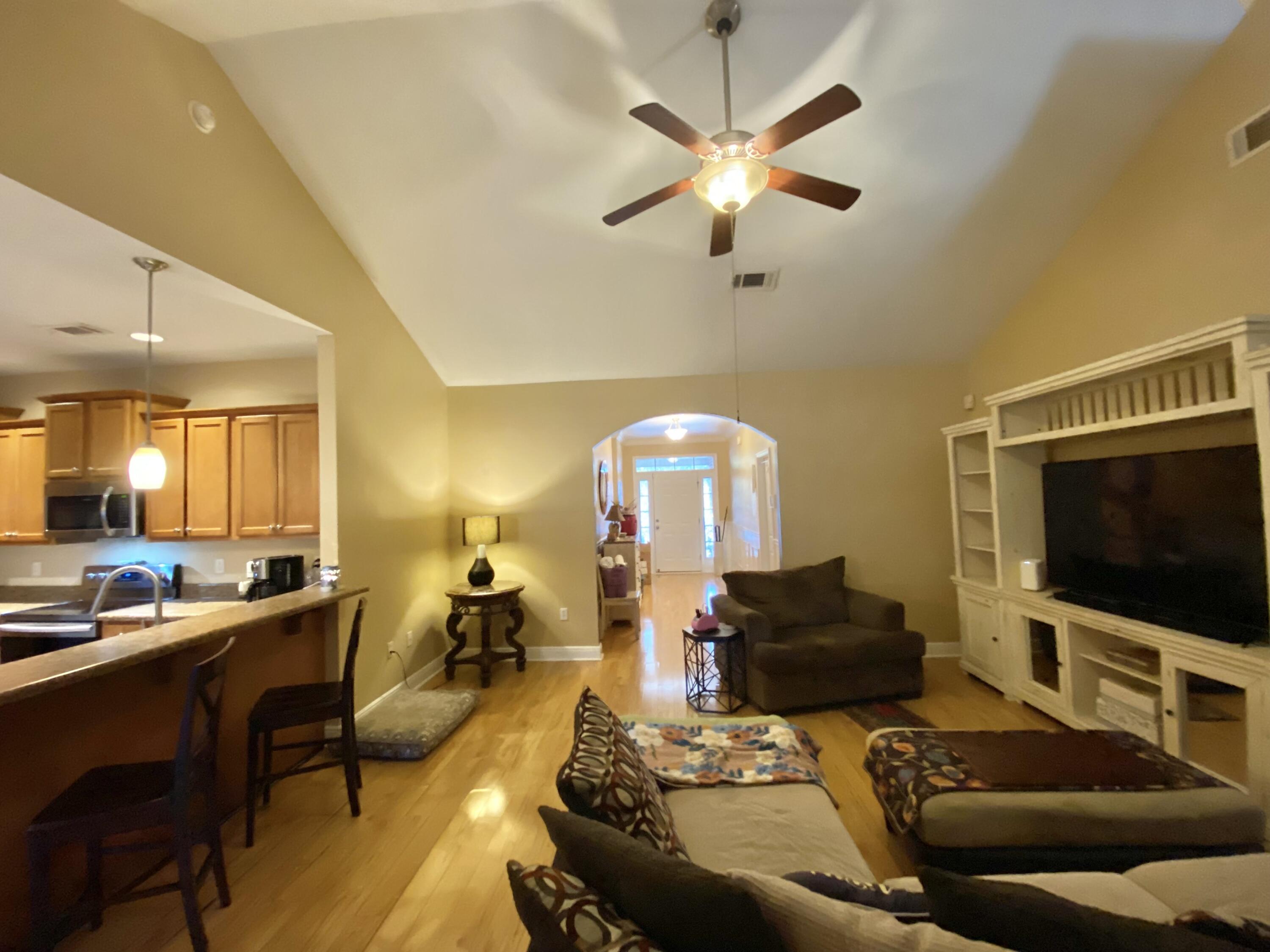 402 Wych Circle Crestview, FL 32536 - Photo 15 of 48 a living room with furniture and a flat screen tv