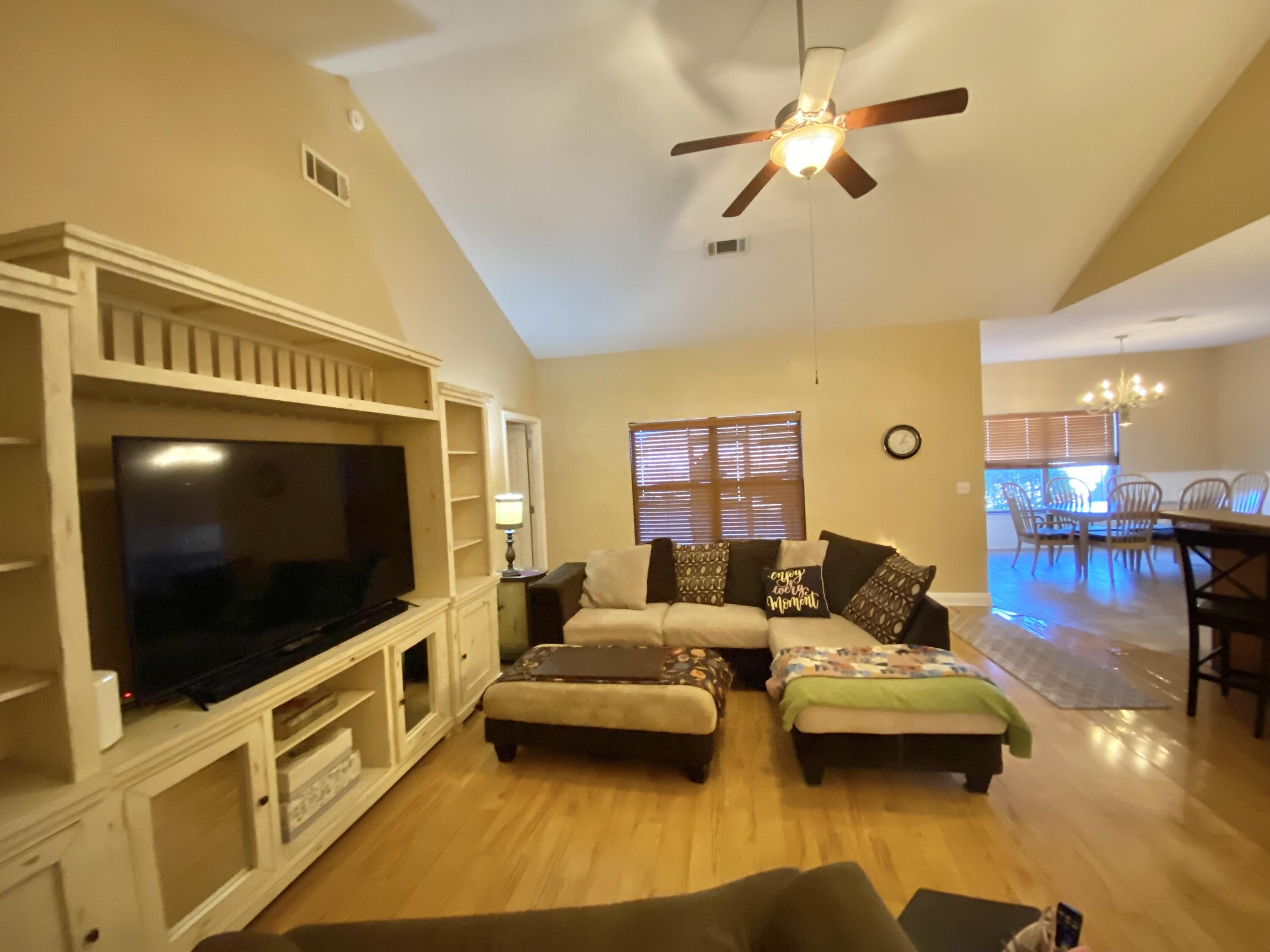 402 Wych Circle Crestview, FL 32536 - Photo 17 of 48 a living room with furniture and a flat screen tv