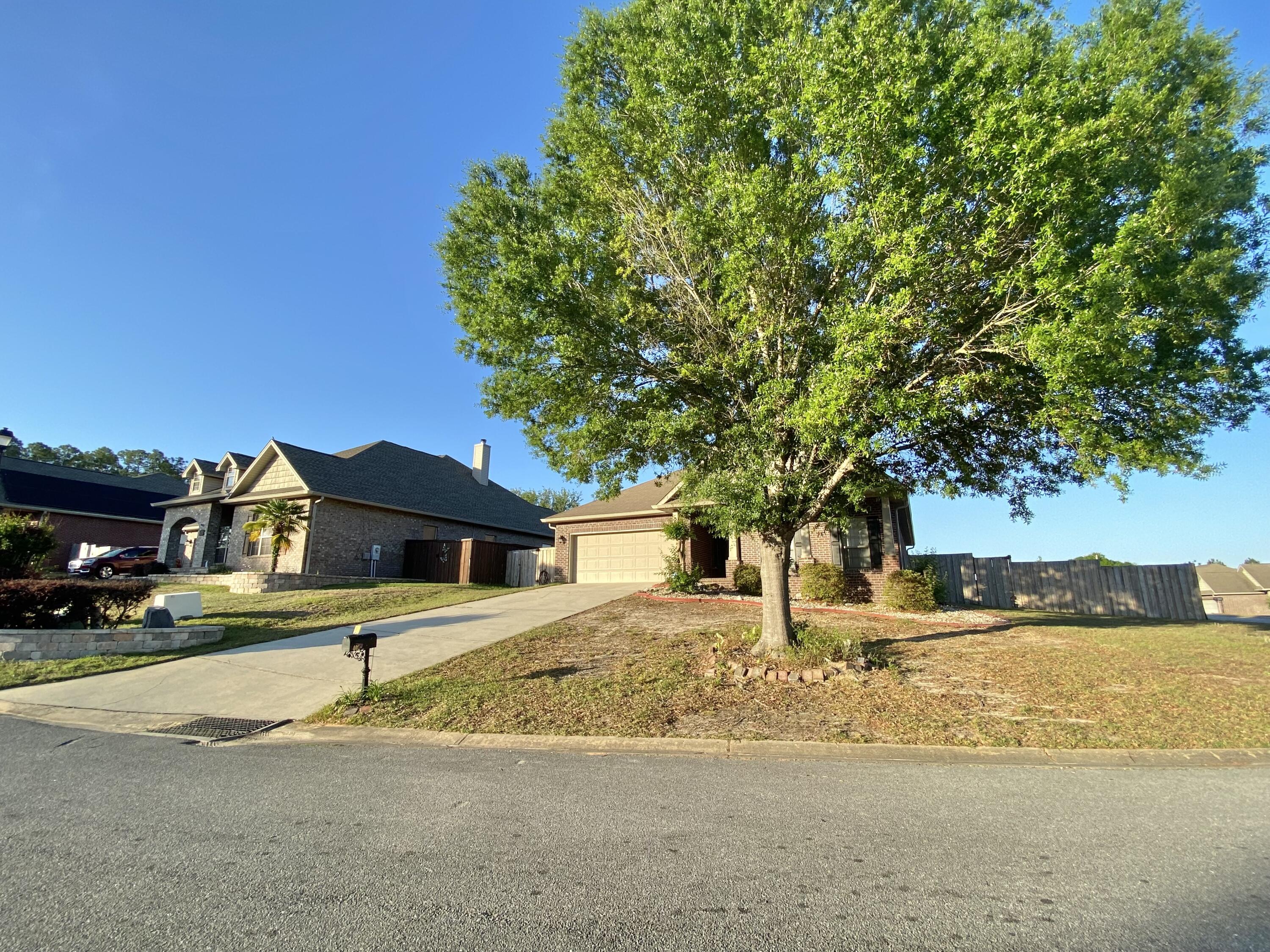 402 Wych Circle Crestview, FL 32536 - Photo 4 of 48 a house with trees in the background