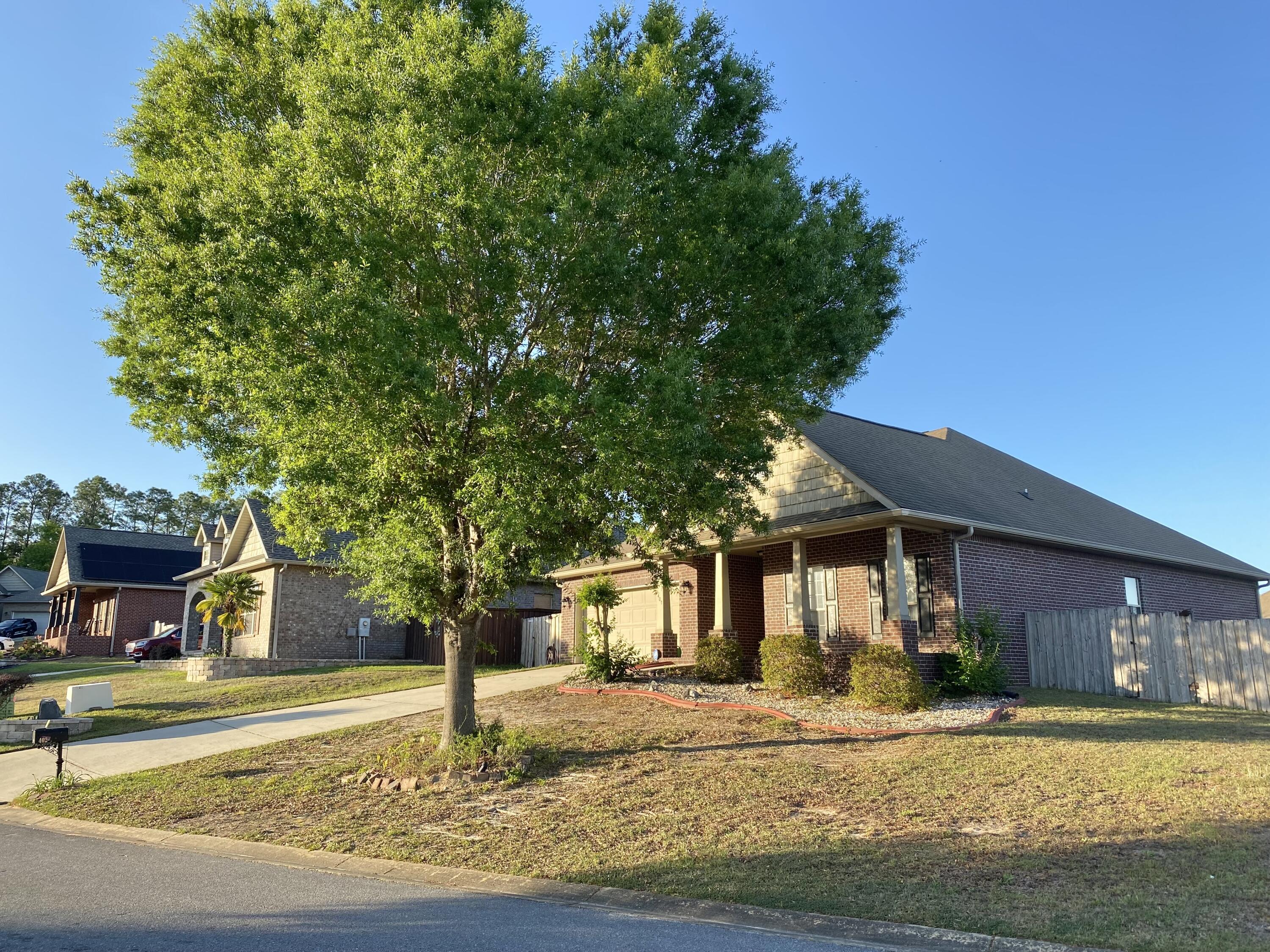 402 Wych Circle Crestview, FL 32536 - Photo 5 of 48 a front view of a house with a yard