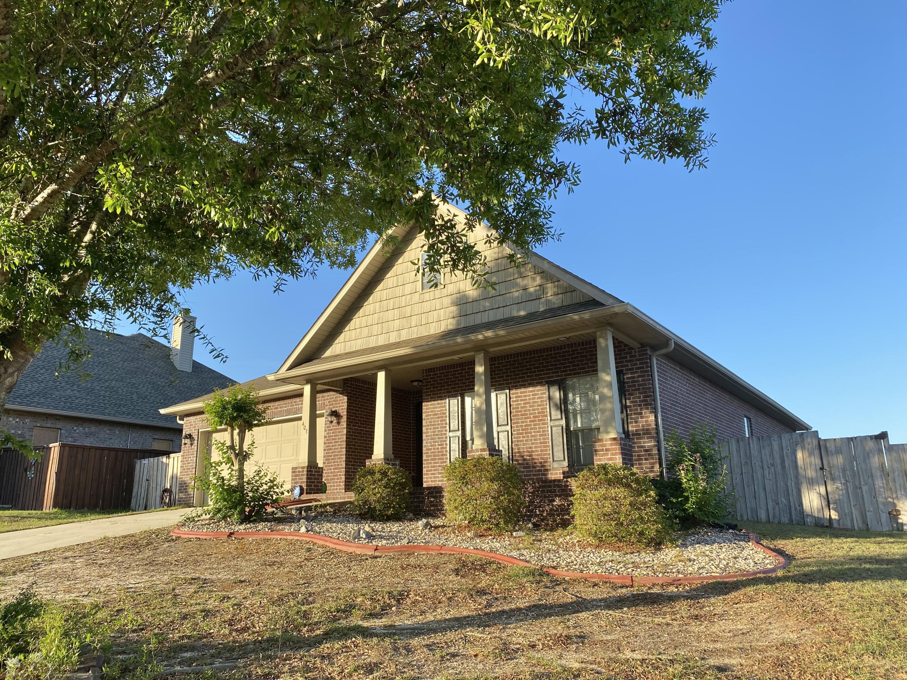 402 Wych Circle Crestview, FL 32536 - Photo 6 of 48 a front view of a house with a yard