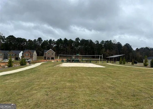 a view of a swimming pool with a yard
