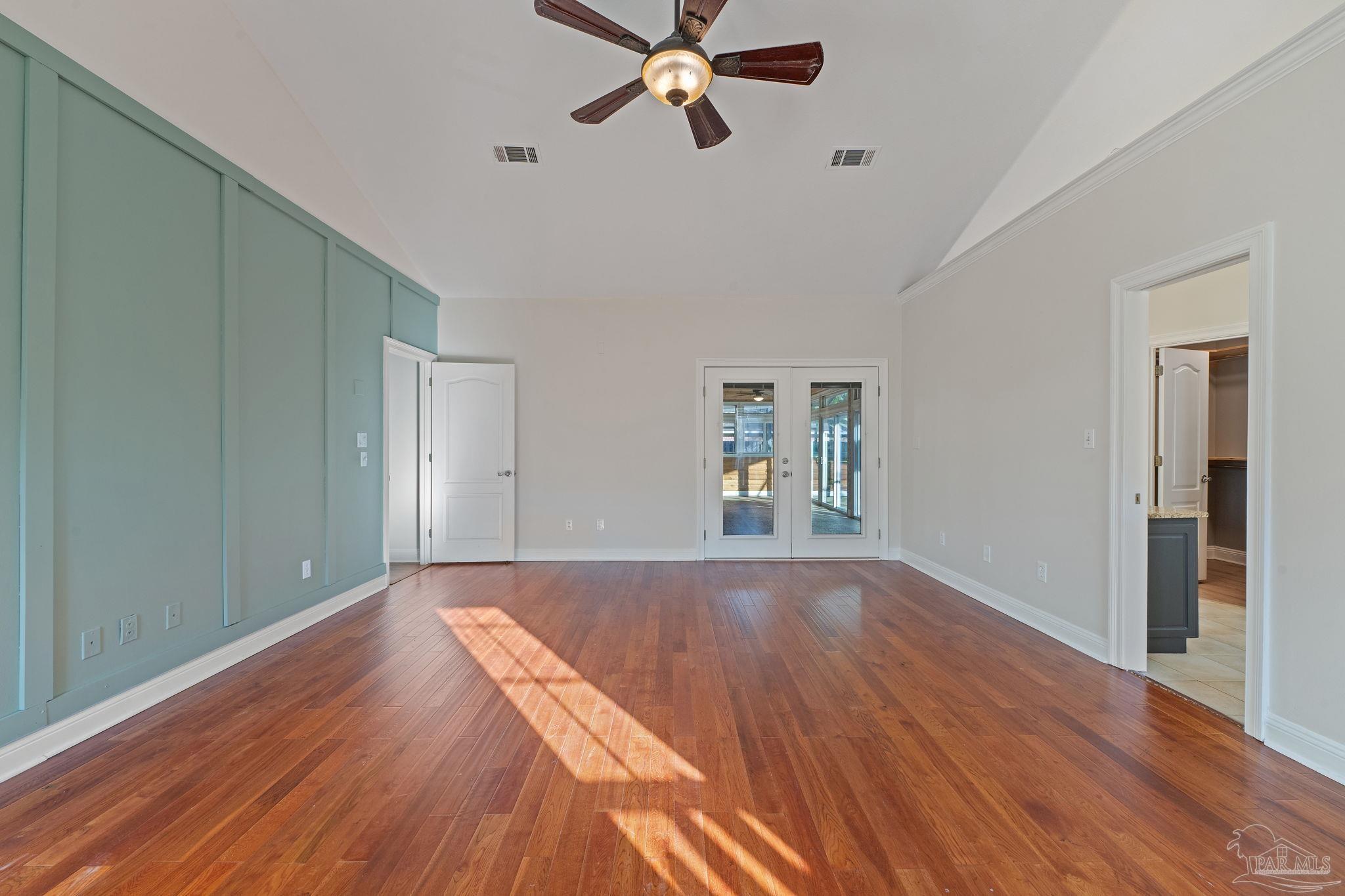 4149 Chartwell Street Pace, FL 32571 - Photo 20 of 49 a view of empty room with wooden floor and fan