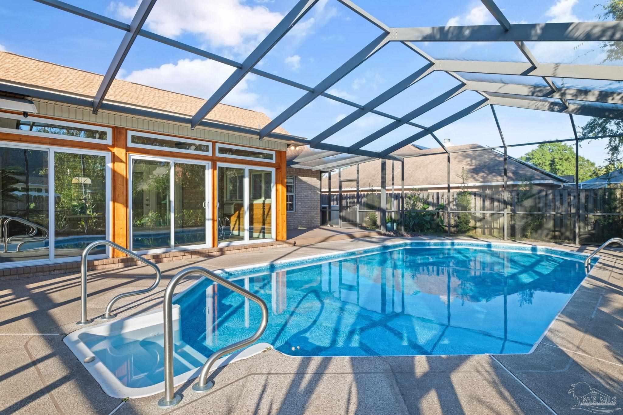 4149 Chartwell Street Pace, FL 32571 - Photo 2 of 49 a view of a patio with table and chairs and wooden floor