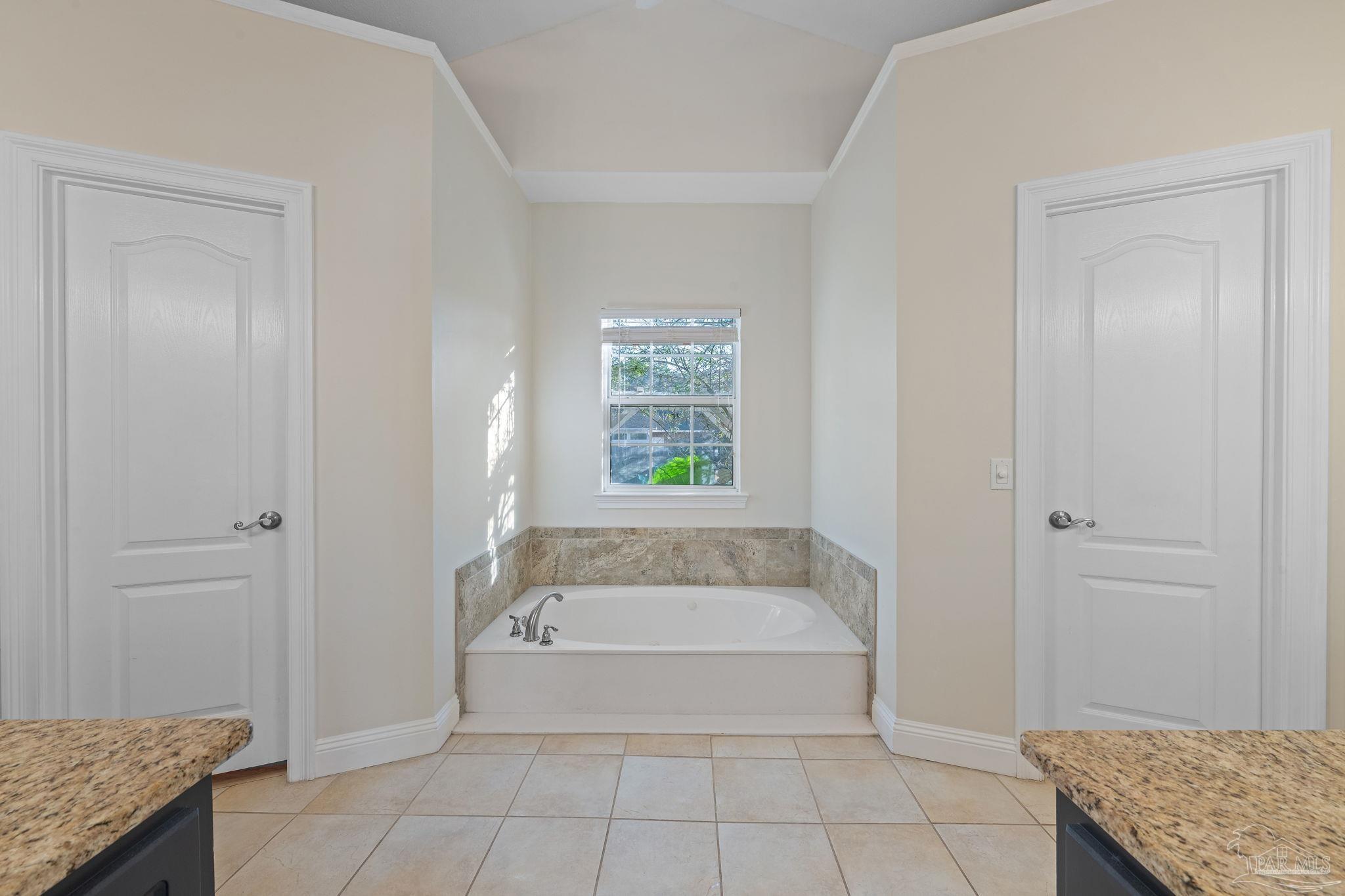 4149 Chartwell Street Pace, FL 32571 - Photo 25 of 49 a spacious bathroom with a granite countertop bathtub and shower