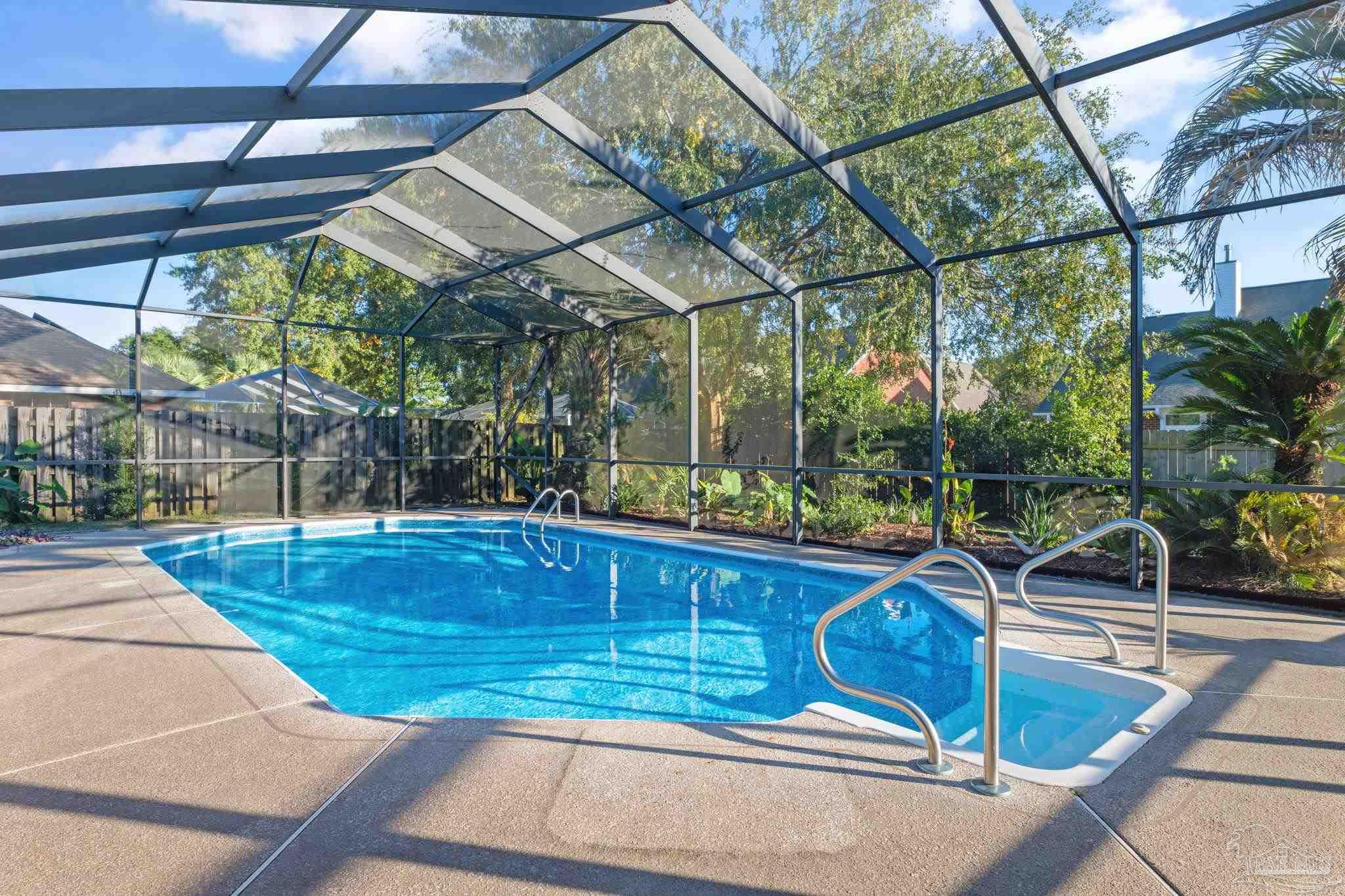 4149 Chartwell Street Pace, FL 32571 - Photo 38 of 49 a view of a swimming pool with a patio