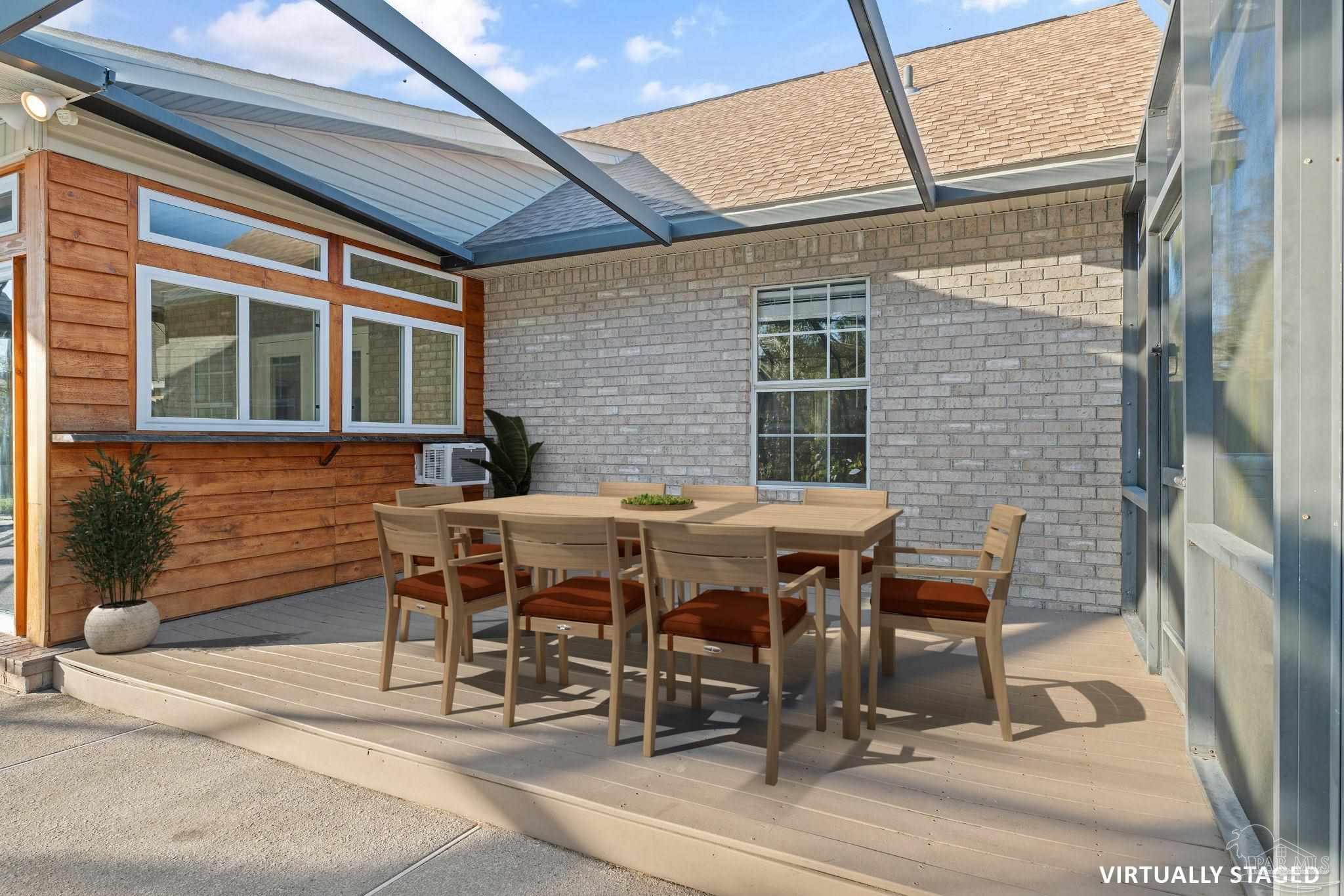 4149 Chartwell Street Pace, FL 32571 - Photo 40 of 49 a patio with a table and chairs