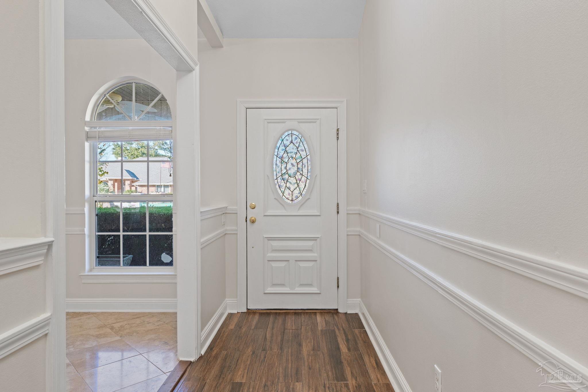 4149 Chartwell Street Pace, FL 32571 - Photo 4 of 49 a view of hallway with stairs and wooden floor