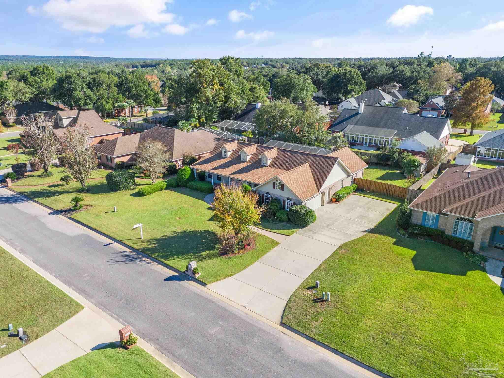 4149 Chartwell Street Pace, FL 32571 - Photo 44 of 49 an aerial view of residential houses with outdoor space and street view