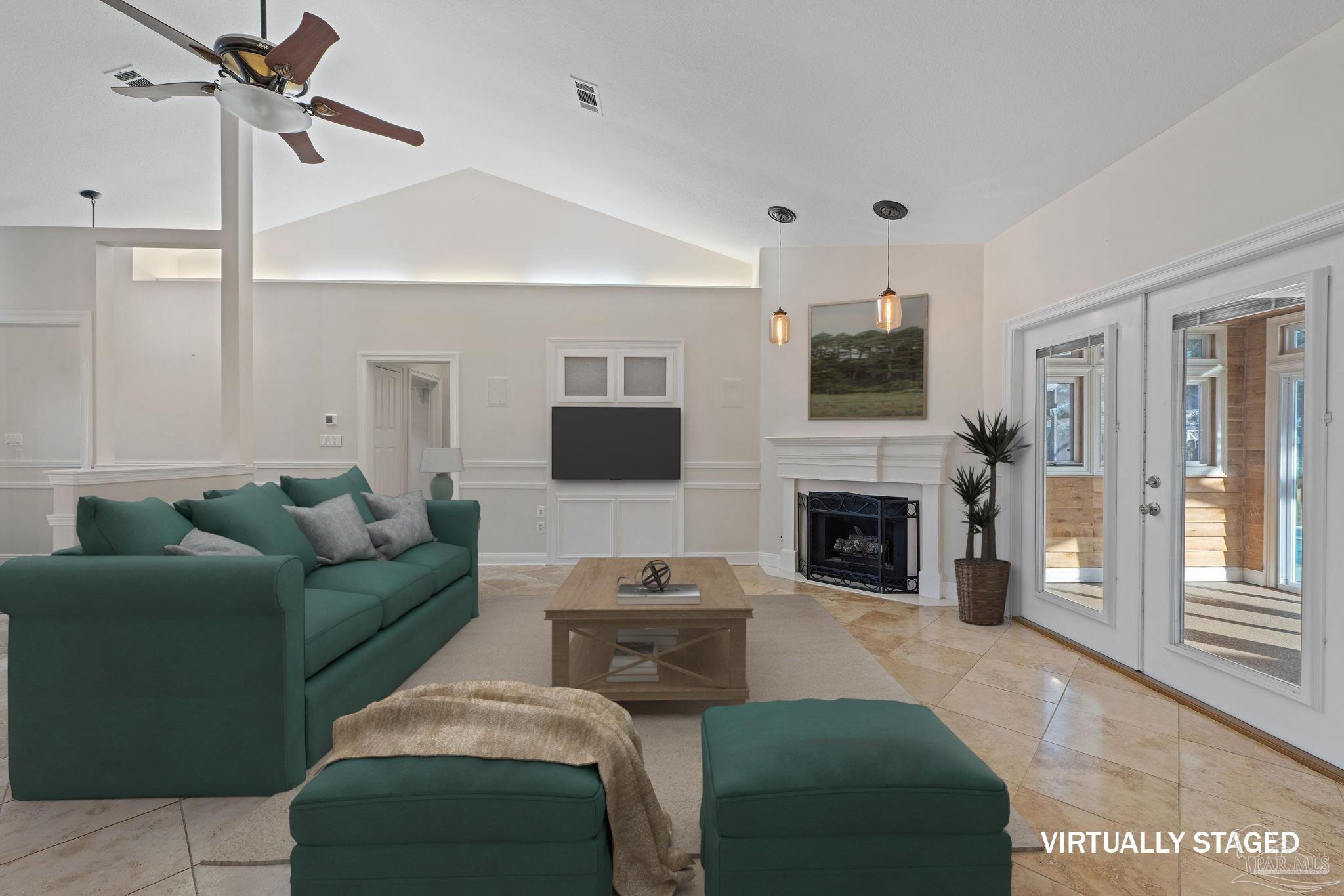 4149 Chartwell Street Pace, FL 32571 - Photo 5 of 49 a living room with furniture a flat screen tv and a fireplace