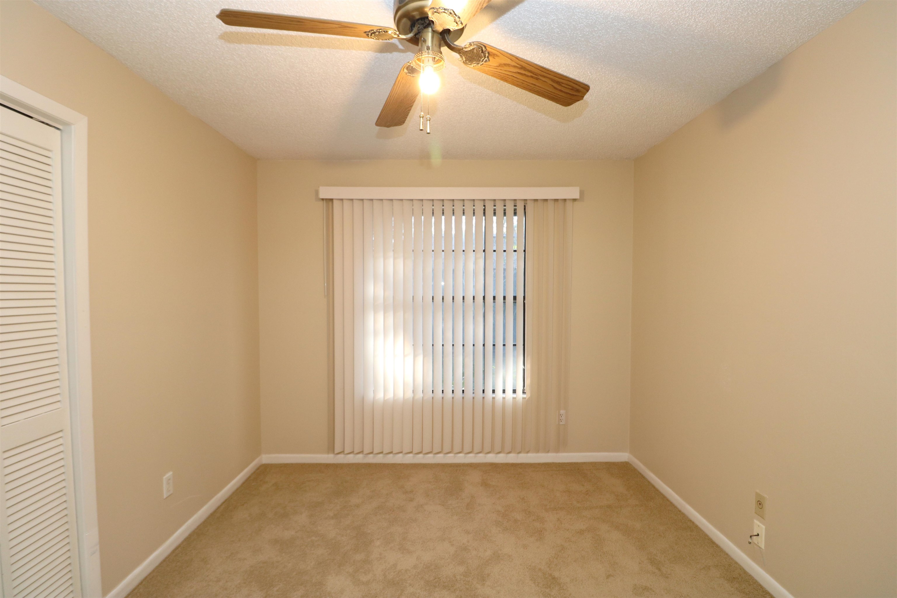 222 Jasmine Road St. Augustine, FL 32086 - Photo 12 of 30 wooden floor in an empty room with a window