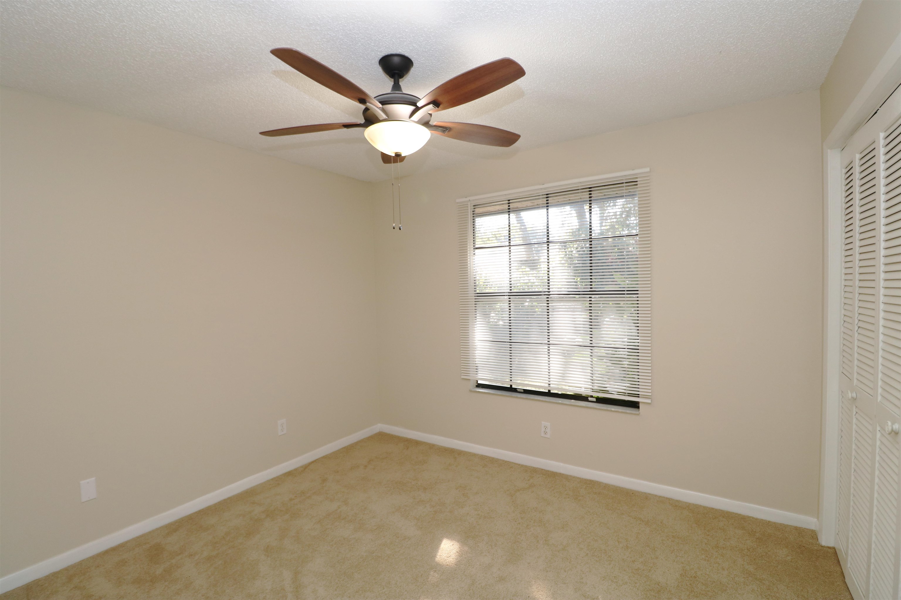222 Jasmine Road St. Augustine, FL 32086 - Photo 14 of 30 an empty room with window and ceiling fan