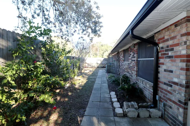 a backyard of a house with lots of green space